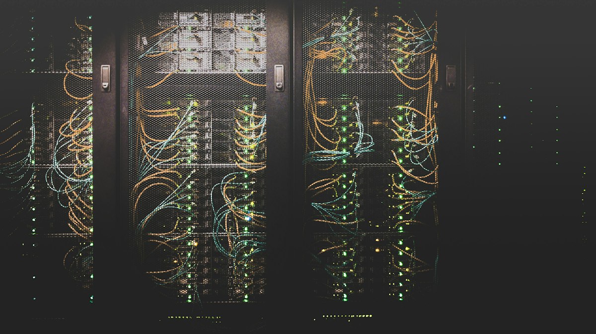 Servers and network cables with blue lights in a modern data center
