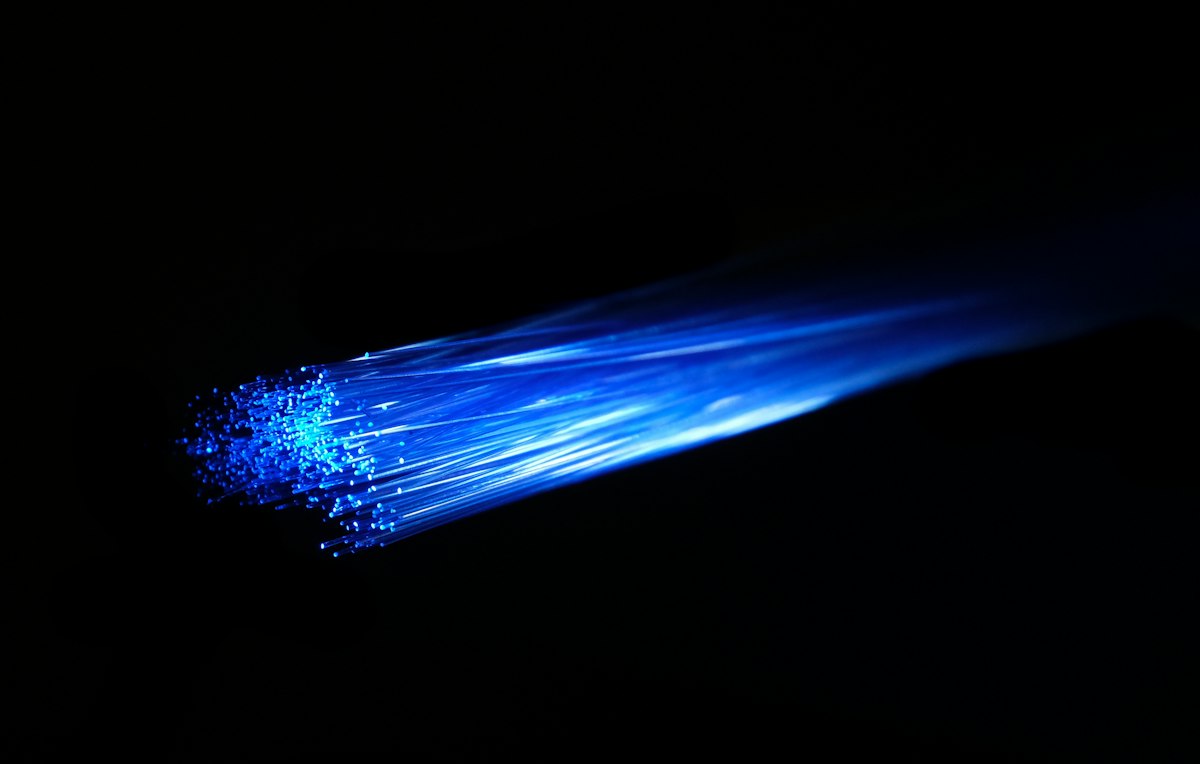 Optical processor with laser light beams representing artificial neural network computations